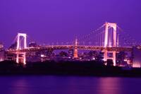 Tokyo at night: the Rainbow Bridge and, behind it, the Tokyo Tower